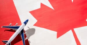 Vancouver Immigration Consultant CIP Canada - Canada Flag with Airplane photo